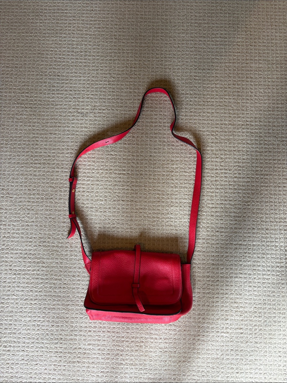 Compact Red Leather Crossbody Bag with Adjustable Strap